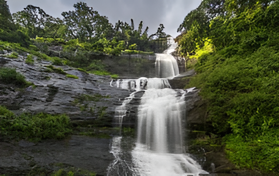 Nyayamakad Waterfalls cascading through tea-covered hills near Munnar